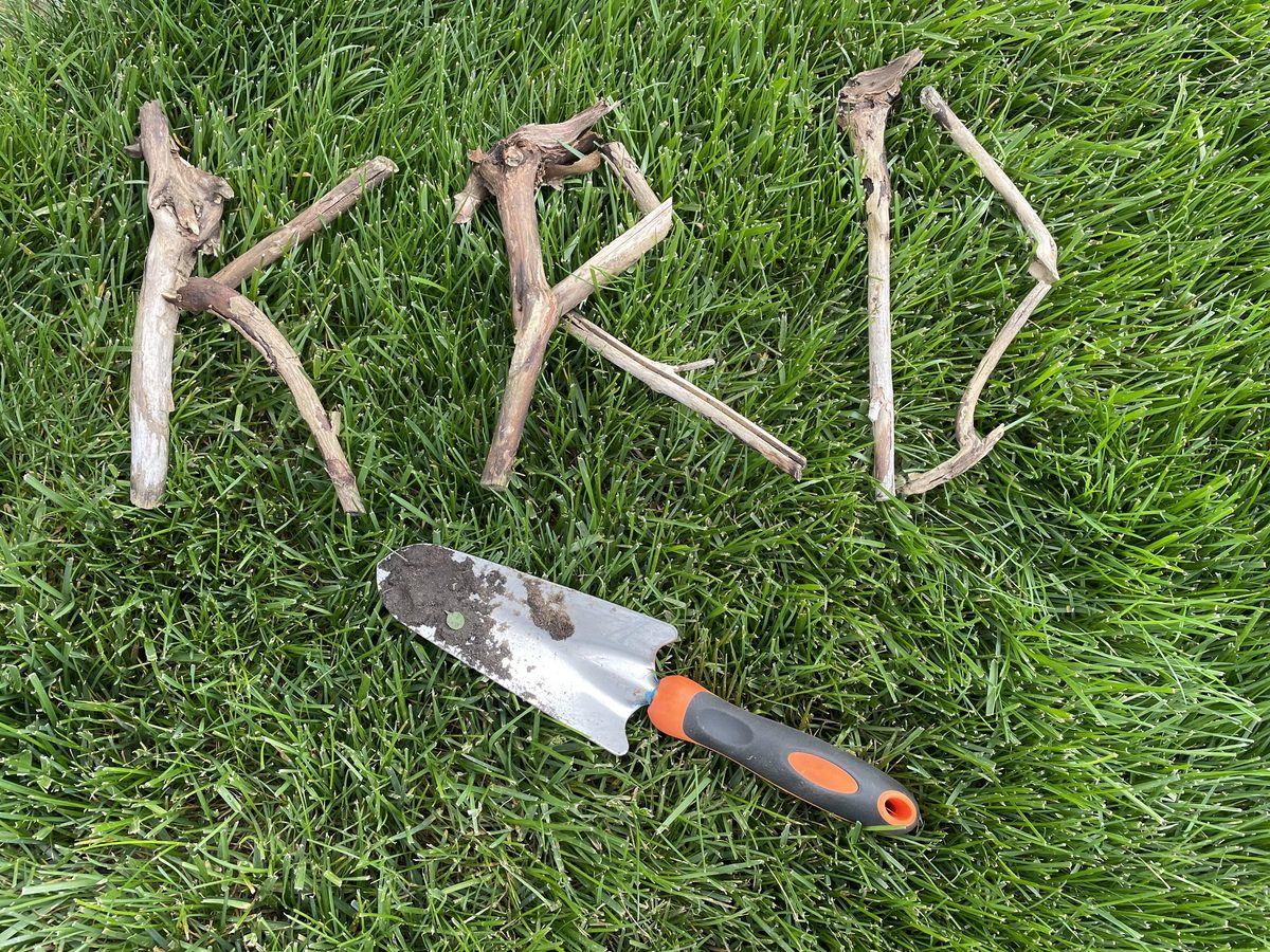 KRD spelled out with twigs on a lawn in Clinton, Michigan